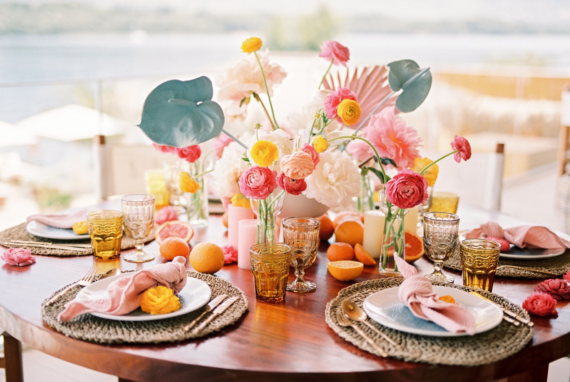 Bright colorful bouquet of flowers stands on a served festive table